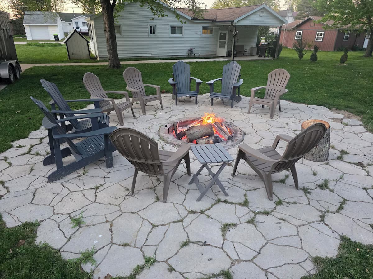 Fire pit gathering with Adirondack chairs